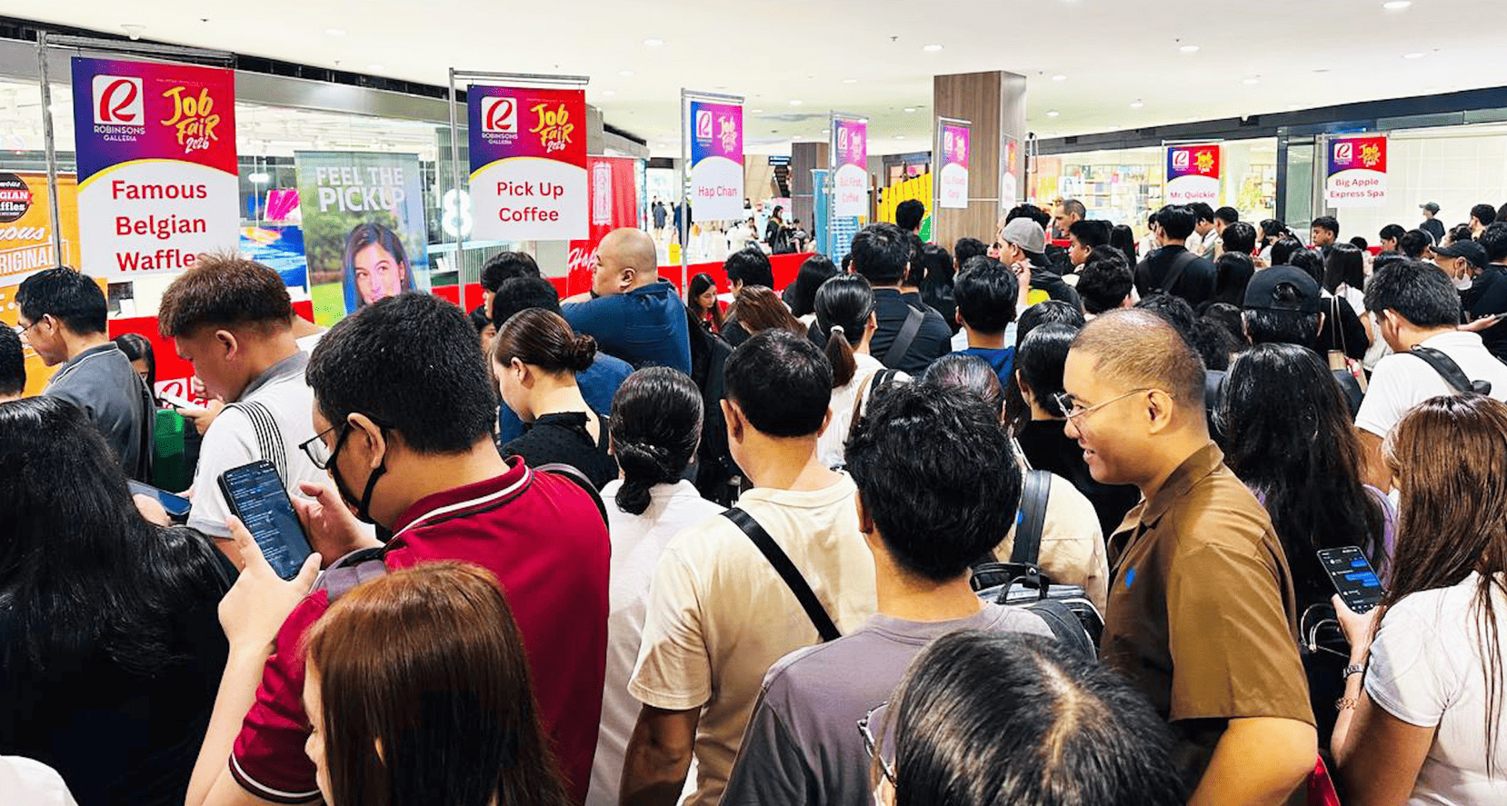 Queues fill Robinsons Galleria as hopeful job seekers await their chance to connect with employers.
